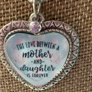 The love between a Mother and Daughter is Forever.

Comes on 18" chain